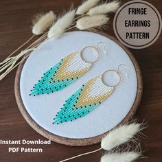 a pair of earrings made out of seed beads on a hoop with the text, fringe earrings pattern