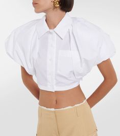 Made from a cotton blend, the la chemise pavane shirt has a cropped silhouette with dramatically oversized, padded shoulders and sleeves that resemble clouds. 94% cotton,6% elastane. Colour: white Elegant Cropped Cotton Shirt, Chic Cropped Cotton Shirt, Chic Collared Cotton Crop Top, Chic Cotton Cropped Shirt, Fitted Collared Cotton Crop Top, Fitted Cotton Collared Crop Top, Fitted Collared Cropped Shirt For Daywear, Fitted Cropped Cotton Shirt, Elegant Fitted Cotton Cropped Shirt