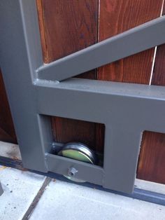 the door is open and there is a metal object in it's opening hole