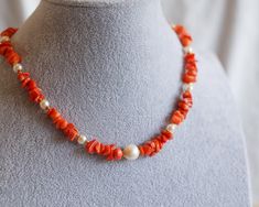 This eye-catching necklace is one-of-a-kind, boasting orange-to-scarlet hued Coral and an oh-so-gleaming baroque Pearl. Plus, the Pearl has a bail, so you can rock it with or without the necklace. This beauty fastens with a Cubic clip that's openable at both ends -- talk about convenience! Pictures don't even do this stunner justice! Whether you're going on an adventure or just layering up your look, this piece is an ideal accessory for any occasion. The length of necklace is approx. 15". The Pe Elegant Luxury Orange Beaded Necklace, Unique Orange Necklace With Polished Beads, Unique Orange Beaded Necklace, Orange Pearl Necklace, Going On An Adventure, Necklace Orange, Orange Coral, The Pearl, Wedding Jewellery Necklace