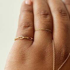 A shiny ring that cuts a cool line, with an uptown girl goes downtown, very New York feeling. Super super excellent in a stack, or on its own. Made with 100% recycled 14k gold. Elegant 14k Gold Cable Chain Ring, Modern Oval Link Rings For Everyday, Modern Everyday Rings With Oval Link, 14k Gold Link Chain Ring, Everyday Gold Midi Rings Made Of Recycled Gold, Minimalist 14k Gold Link Chain Ring, Classic Oval Link Chain Ring For Everyday, Classic Gold Chain Rings As Gifts, Classic Rings With Gold Chain For Gift