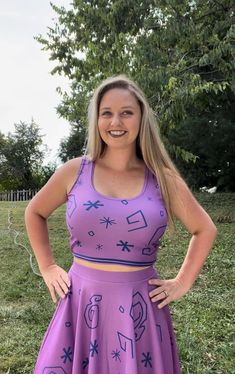 "Product Description: Elevate your style with the enchanting \"Purple Teacup\" Sleeveless Crop Top. This delightful crop top effortlessly combines whimsy with elegance, creating a versatile and fashionable addition to your wardrobe. Key Features: Enchanting Teacup Design: The \"Purple Teacup\" Crop Top features a captivating teacup pattern that adds a touch of magic to your outfit. The intricately detailed teacup motifs create a visual spectacle that's both charming and captivating. Sleeveless Comfort: Crafted with a sleeveless design, this crop top offers freedom of movement and comfort, making it an ideal choice for warm days and social gatherings. Versatile Crop Length: The crop length adds a modern and stylish edge to your ensemble, making it easy to pair with high-waisted skirts, jean Purple Fitted Sleeveless Tank Top, Fitted Purple Sleeveless Tank Top, Fitted Sleeveless Purple Tank Top, Casual Purple Sleeveless Sports Bra, Purple Sleeveless Crop Top For Summer, Lavender Sleeveless Crop Top, Casual Fitted Purple Sports Bra, Purple Cropped Tank Top For Summer, Purple Fitted Cropped Tank Top