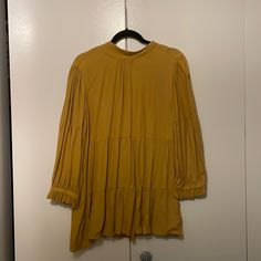 Nwt Never Worn Mustard Blouse Size Small 100% Viscose This Top Is Super Flowy And Fits Like A Tunic. Would Be Great Over Leggings For A Fall Outfit. Color Is A True Gold Mustard. Chic Mustard Blouse For Fall, Mustard Long Sleeve Blouse For Fall, Yellow Ruffled Long Sleeve Tops, Yellow Fall Blouse For Daywear, Yellow Flowy Casual Blouse, Yellow Fall Daywear Blouse, Casual Flowy Yellow Blouse, Flowy Yellow Casual Blouse, Flowy Yellow Blouse For Fall