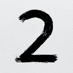 the number two is painted in black on a white paper background and it appears to be made from brush strokes