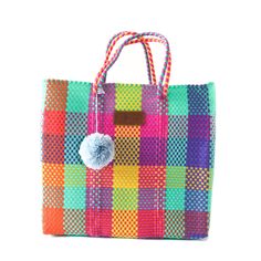 "Handwoven by artisans in Mexico using 100% recycled plastic our totes are the perfect go-to for all occasions. Take your bag from the gym, to work, to a beach day, and a stroll around town while carrying all your essentials in this lightweight stylish tote. Crafted from ethically sourced high-quality materials this bag is durable, flexible, and waterproof, made to last for years. Our redesigned Totes now have a detachable nylon pouch with zipper closure that fits your phone, wallet, or anything Everyday Multicolor Bag Made Of Recycled Materials, Everyday Multicolor Recycled Material Bag, Everyday Multicolor Woven Beach Bag, Multicolor Bags Made Of Recycled Materials For Everyday Use, Multicolor Reusable Beach Bag, Multicolor Recycled Material Bags For Everyday Use, Multicolor Recyclable Beach Bag For Vacation, Everyday Multicolor Bags Made From Recycled Materials, Multicolor Rectangular Bag Made Of Recycled Materials