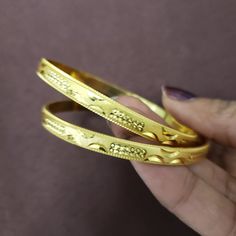 "* Handcrafted Gold Plated Bangle Set * High Quality 22 K Gold Plated 2 pc bangle set; * Size- 2.6 ( Inner Diameter: 2.42\"), Size- 2.8 ( Inner Diameter: 2.56\"), * Sold as a set of 2 bangles Gorgeous gold-plated bangle/ bracelet best exemplifies the careful craftsmanship done on it -- a specialty at Nemali Jewelry. It has special tone of elegance attached to it. The intricate handmade design of the bangle / bracelet set gives it a fresh and original look. Look your best with this elegant-lookin Marriage Bangle With Intricate Design, Adjustable Elegant Bangle For Puja, Wedding Bangles, Bollywood Bridal, Kundan Bangles, Bracelet Fil, Glass Bangles, Gold Plated Bangles, The Bangles