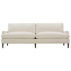 a white couch sitting on top of a wooden frame