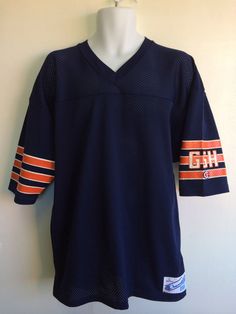 Here's an 80's Bears jersey for any fan. It's an authentic, never before worn, pristine condition rarity! It has the classic GSH painted on the sleeve to commemorate Papa Bear and is otherwise blank, supporting the whole team, the fans, Chicago, and everything Bears! Condition: Mint. Check out other vintage jerseys & sports gear in my shop https://www.etsy.com/shop/sweetVTGtshirt?section_id=11916422&ref=shopsection_leftnav_5 Label: Champion Color: Navy Material: 100% Nylon Measurements ( Cotton Fan Gear Jersey With Short Sleeves, Cotton Short Sleeve Fan Gear Jersey, Cotton Fan Gear Jersey With Crew Neck, Cotton Crew Neck Jersey For Fan Gear, Throwback Short Sleeve Jersey For College, Throwback Short Sleeve College Jersey, Crew Neck Jersey For Fan Merchandise, Fan Merchandise Cotton Short Sleeve Jersey, Casual Crew Neck Jersey For Fan Gear