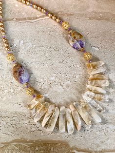 Citrine Necklace featuring natural citrine spikes accented with oval flower amethyst stones, Bali style gold over copper Bali style beads and 8mm champagne color crystal pearls and 5MM violet Swarovski crystals.  Gold filled toggle clasp.  Beautiful statement necklace.  Handmade Necklace measures 22 inches. Beaded Necklace Patterns, Baltic Amber Jewelry, Spike Necklace, Citrine Beads, Citrine Necklace, Necklace Flower, Necklace Patterns, Hippie Necklace, Handcrafted Artisan Jewelry