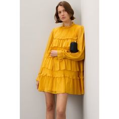 Yellow chiffon (100% Polyester). Shift. Long sleeves. Mock neck. Back button closure. 34.5" from shoulder to hemline. Imported. Chic Spring Chiffon Ruffle Dress, Spring Pleated Long Sleeve Chiffon Dress, Spring Long Sleeve Pleated Chiffon Dress, Pleated Long Sleeve Chiffon Dress For Spring, Long Sleeve Pleated Chiffon Dress For Spring, Chic Flowy Chiffon Dress With Ruffles, Spring Chiffon Dress With Ruffles For Casual Wear, Spring Chiffon Dress With Ruffles, Spring Casual Chiffon Dress With Ruffles