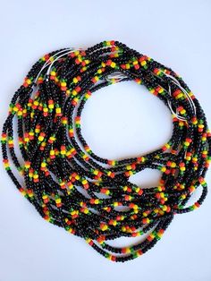 Guyana🇬🇾 flag waist beads These waist beads are cotton string tie arounds to track your weight and are permanent until they are cut off your body. How do you know you are losing weight without weighing often? The waist beads will begin loosen as you lose weight. They will start to hang down. Make sure before tying that there is a bit of wiggle room for comfort. Black Beaded Necklaces For The Beach, Multicolor Waist Beads With Large Beads For Festival, Multicolor Large Beaded Waist Beads For Festival, Multicolor Large Beaded Waist Jewelry For Festival, Adjustable Multicolor Waist Beads With Large Beads, Multicolor Large Beads Waist Beads As Gift, Multicolor Large Beads Waist Beads For Gift, Gift Multicolor Waist Beads With Large Beads, Black Round Beads For Festival