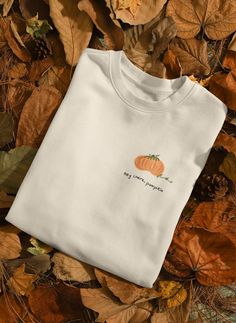 Fun and cute fall sweatshirt, perfect for back to school or university. This handmade 'hey there pumpkin' design sweatshirt is fun and cozy, made with ethically sourced cotton. It is a perfect gift in line with the fall season, bringing a warm and festive vibe to the wearer. Ideal for students heading back to school or anyone looking to embrace the autumn spirit. Product features - Made with a medium-heavy fabric blend of 50% cotton and 50% polyester for coziness during colder months - Ribbed kn Fall Everyday Cotton Sweatshirt, Comfortable Fit Sweatshirt For Everyday Fall Wear, Comfortable Everyday Sweatshirt For Fall, Cute Relaxed Fit Sweatshirt For Fall, Fall Cotton Orange Sweater, Cute Fall Letter Print Sweatshirt, Cute Letter Print Sweatshirt For Fall, Fall Cotton T-shirt, Cute Fall T-shirt