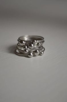 This set has 9 silver stacked rings. One of a kind. Size 6 1/2 They are already made and ready to ship. Modern Stacked Ring Jewelry, Modern Silver Stackable Bands, Modern Stackable Silver Bands, Silver Stacked Jewelry For Anniversary, Stacked Silver Jewelry For Anniversary, Sterling Silver Stacked Jewelry For Anniversary, Stacked Sterling Silver Jewelry For Anniversary, Elegant Stacked Sterling Silver Jewelry, Adjustable Stacked Silver Rings