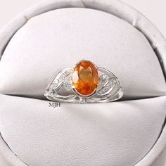 Orange Oval Sapphire Gemstone Ring, Orange Oval Sapphire Ring, Oval Citrine Birthstone Crystal Ring, Oval Citrine Crystal Ring With Birthstone, Oval Amber Topaz Ring, Oval Orange Gemstone Ring, Orange Oval Gemstone Ring, Oval Orange Topaz Gemstone Ring, Amber Birthstone Ring