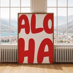 a red and white sign that says alo ha in front of a large window