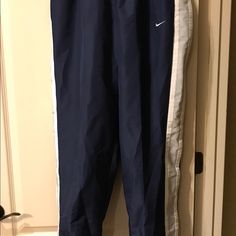 Brand New With Tags Blue / White / Silver Tearaway Athletic Pants Which Are Fully Lined. Non-Smoking Home. Nike Navy Bottoms For Loungewear, Nike Navy Loungewear Bottoms, Navy Nike Bottoms For Loungewear, Mens Nike Sweatpants, Nike Tech Fleece Pants, Nike Joggers, Olive Green Pants, Tapered Joggers, Vintage Windbreaker