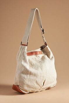 Natural: Hemp; leather trim Navy, Carbon: Cotton, hemp; leather trim Two inner slip pockets One inner zip pocket One inner key fob clasp Snap styling Machine wash Imported | Canvas Crossbody Bucket Bag by 49 Square Miles in Beige, Women's, Cotton/Leather at Anthropologie Lighted Canvas, Key Fob, Leather Trim, Leather Trims, Bucket Bag, Women's Accessories, Leather Straps, Zip Pockets, Crossbody Bag