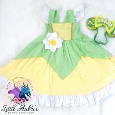 ✨Dress your princess in the cutest dresses without compromising comfort. These dresses are park comfort approved.  ✨Dress and removable flower brooch only. Hair accessories sold separately. ✨95% Cotton 5% Spandex. High quality cotton material.  ✨Runs very true to size.  Dress length measurements: 3m - 14 in. length 6m - 15 in. length 9m - 16 in. length 12m - 18 in. length 18m - 20 in. length  2T - 21 in. length 3T - 22 in. length 4T - 24 in. length 5Y - 27 in. length 6Y - 28 in. length 7Y - 30 in. length 8Y - 31 in. length  10Y - 32.5 in. length 12Y - 34 in. length Cute Tutu Dress With Floral Applique For Dress-up, Cute Floral Applique Tutu Dress For Dress-up, Green Princess Dress With Floral Applique, Princess Style Fairy Dress For Garden Party, Cute Snow White Dress For Dress-up, Green Princess Dress With Floral Applique For Dress-up, Green Princess Dress For Fancy Dress, Whimsical Green Tutu Dress For Dress-up, Green Princess Dress For Dress-up