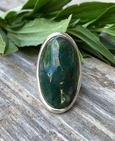 "Sterling Silver Aquatic Moss Agate Big Statement Ring Size 7 Up for offer is a hand made heavy solid sterling silver and aquatic moss agate big statement ring. Ring is marked \"925\". Measurements Ring Size: 7 Ring Face: L 1.5\" x W 0.75\" Moss Agate: 32mm x 22mm x 6mm Band Width: 5.5mm Weight: 15.4 g Materials -Sterling Silver -Moss Agate Condition: New; Please inspect pictures for overall condition. This item comes from a clean, smoke free household. Item will ship within 24-48 hours of sale. Unique Oval Emerald Ring With Polished Finish, Handmade Silver Rings With Moss Agate, Handmade Silver Moss Agate Rings, Handmade Oval Moss Agate Ring, Silver Moss Agate Ring With Natural Inclusions, Silver Polished Oval Cabochon Emerald Ring, Silver Emerald Ring With Polished Oval Cabochon, Polished Agate Oval Cabochon Rings, Agate Cabochon Rings For Healing