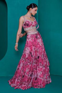 Pink digital floral print georgette lehenga with silver zari, badla and sequin embroidery in two tier style. Paired with a printed and embroidered blouse, dupatta and waistbelt.
Components: 4
Pattern: Printed, Embroidered
Type Of Work: Zari, Sequin, Badla
Neckline: Sweetheart
Sleeve Type: Sleeveless
Fabric: Georgette
Color: Pink
Other Details: 
Padded blouse
Attached cancan
Approx. product weight: 4 -5 kgs
Length:
Lehenga: 46 inches
Blouse: 15 inches
Occasion: Mehendi and Haldi - Aza Fashions Organza Wedding Dress With Digital Print, Wedding Dress With Digital Print On Organza, Georgette Digital Print Set For Party, Bollywood Style Floral Print Georgette Lehenga, Bollywood Style Floral Georgette Lehenga, Fitted Digital Print Georgette Sharara, Georgette Maxi Sets With Floral Print, Floral Print Georgette Maxi Sets, Party Sets In Georgette With Digital Print