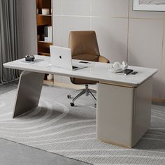 an office desk with a laptop on it