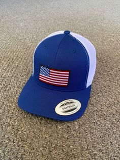 "This is a NEW United States of America Flag Embroidered Patch applied by hand to a high quality Yupoong or Richardson brand snapBack trucker hat Yupoong Classic SnapBacks are 65% Polyester/35% Cotton Structured 3 1/2\" mid-profile six-panel Permacurv Visor adjustable 6 7/8\" to 7 1/2\" Richardson Hats are 60% cotton/40% polyester Structured 3 1/2\" mid-profile six-panel Pre-curved Visor adjustable snapback closure 6 3/4\" -7 5/8\" Every Hat Design is Created and Individually HANDCRAFTED to orde Patriotic White Trucker Hat With Curved Brim, White Patriotic Adjustable Trucker Hat, Patriotic Trucker Hat One Size Fits Most, White Patriotic Hat With Curved Bill, Patriotic White Hat With Curved Bill, Adjustable Patriotic Hat For Outdoors, American Style Adjustable Hat With Flat Brim, Adjustable Patriotic Outdoor Hat, American Style Adjustable Flat Brim Hat