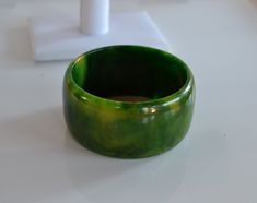 STATEMENT wide Art Deco end of day marbled green yellow bangle bracelet vintage tested  - tested with simichrome  2.5 inches inner diameter; 1/4 inches width; 1.5 inches tall good condition with some fine surface scratches - sold as is. Thank you for watching my other items! a huge collection of plastic jewelry is listed and much more to come! Combined shipping available where possible -please contact us for details before buying the items. Unique Green Cuff Bracelet Bangle, Unique Green Cuff Bangle Bracelet, Handmade Green Round Cuff Bracelet, Unique Green Bangle Cuff Bracelet, Unique Green Round Bangle, Wide Art, Plastic Gift Wrap, Yellow Costume, Bakelite Bangles