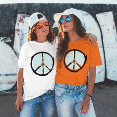 Retro Peace Shirt,  60's, 70's Hippie, Peace Sign, Festival, Woodstock Party, Grunge, Flower Power, Peace Out Tee. This classic unisex jersey short sleeve tee fits like a well-loved favorite. Soft cotton and quality print make users fall in love with it over and over again. These t-shirts have-ribbed knit collars to bolster shaping. The shoulders have taping for better fit over time. Dual side seams hold the garment's shape for longer.  .: 100% Airlume combed and ringspun cotton (fiber content m Vintage Spring Top For Concerts, Retro Summer Tops For Concerts, White Retro Print Tops For Spring, Spring White Top With Retro Print, Retro White Tops For Music Festivals, Retro Spring Tops For Concerts, Retro Orange T-shirt For Spring, Retro Spring Concert T-shirt, 70s Inspired Graphic Print Tops For Spring