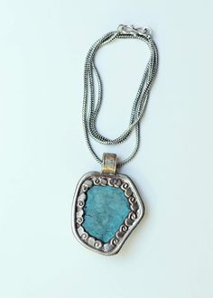 Rough turquoise Lead + nickel free Hand picked from Nepal The Turquoise Hills Necklace features rough turquoise with a beautiful open design on the back of each pendant. Each pendant is 2" and comes with a 10" mixed metal chain. Unique Turquoise Nickel-free Necklace, Blue Turquoise Necklace With Oxidized Finish As Gift, Gift Turquoise Necklace With Oxidized Finish, Unique Nickel-free Turquoise Necklace, Blue Oxidized Pendant Jewelry, Turquoise Pendant Necklace With Patina, Bohemian Silver Turquoise Necklace Soldered, Silver Bohemian Turquoise Necklace, Soldered, Silver Bohemian Turquoise Necklace