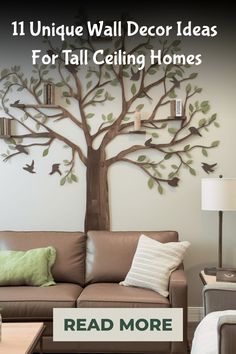 a living room with a tree painted on the wall and text reading 11 unique wall decor ideas for tall ceilings