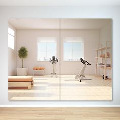 an empty room with white walls and wooden flooring is reflected in the mirror on the wall