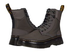 Dr. Martens Tarik - Shoes : Gunmetal Extra Tough 50/50/Ajax : An iconic combat boot silhouette, the Dr. Martens Tarik boots pair easily with your favorite denim and feature a genuine leather upper. Tall, lace up boot with pull tab at heel and round toe. Textile lining and insole. Durable synthetic outsole. Imported. Measurements: Heel Height: 1 1 2 in Weight: 1 lb 14 oz Platform Height: 8 in Product measurements were taken using size UK 8 (US Men's 9, US Women's 10), width Medium. Please note th Rugged Steel Toe Martin Boots For Fall, Streetwear High Ankle Lace-up Boots With Reinforced Toe, Winter Lace-up Boots With Reinforced Toe, Winter Streetwear Lace-up Boots With Steel Toe, Rugged Insulated Lace-up Combat Boots, Fall Outdoor Lace-up Boots With Reinforced Heel, Fall Hiking Combat Boots With Reinforced Toe, Fall Steel Toe Lace-up Martin Boots, Steel Toe Lace-up Boots For Streetwear