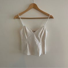 Cute Little White Zara Top -Perfect White Zara Top Brand New -I Feel Like It’s Cute For Going Out -Perfect Condition -Size Xs White Fitted Summer Camisole, White Fitted Feminine Tank Top, White Feminine Spaghetti Strap Top, Feminine White Camisole Crop Top, Elegant White Camisole For Brunch, White Linen Cami Tank Top, Chic White Crop Top Camisole, White Crop Top Camisole For Day Out, White Cropped Camisole For Summer