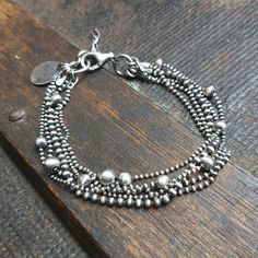 "Handmade oxidized sterling silver chain bracelet with balls (4 and 5 mm). The bracelet is made of silver 925.  It is available with either raw or polished finish  - the photo shows raw bracelet. We offer bracelets in many sizes of the wrist circumference: 6\" (15 cm), 6.5\" (16,5 cm), 7\" (18 cm), 7.5\" (19 cm), 8\" (20,5 cm), 8.5\" (21.5 cm), 9\" (23 cm).  Choose the one that is most similar for your wrist circumference and share your actual wrist circumference in the note to your order. This way we can perfectly adjust the size of your bracelet. We send jewelry in an elegant box. Thanks for visiting Treendystudio!" Silver Satellite Chain Metal Bracelet, Silver Metal Satellite Chain Bracelet, Silver Bracelets With Satellite Chain, Silver Bracelet With Satellite Chain, Silver Sterling Bracelets With Satellite Chain, Silver Sterling Satellite Chain Bracelets, Silver Chain Bracelet, Oxidized Sterling Silver, Handmade Sterling Silver