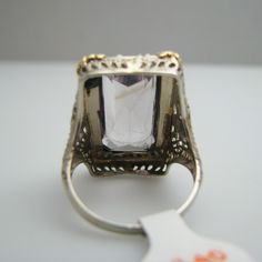 "For sale: (1) d840 14k White Gold Amethyst Seed Pearl Ring PLEASE READ ENTIRE DESCRIPTION BEFORE PURCHASING Pre-owned item. Good condition. Please see pictures for details. Sold as is, as seen on pictures. This ring contains one large amethyst and 41 seed pearls. It is not stamped, but has been tested for authenticity. Specifics: 14k White gold Size: 7 (U.S.) Stone Dimensions: 20 mm x 10 mm Width: 24.3 mm Total Weight: 6.9 grams Please be 100% sure of your purchase before buying, as we do not o Elegant Amethyst Crystal Ring In White Gold, Formal Sapphire Ring With Octagon Diamond Cut, Luxury Emerald-cut Amethyst Ring For Formal Events, Luxury Emerald Cut Amethyst Ring For Formal Occasions, Formal Octagon Sapphire Ring With Diamond Cut, Formal 14k Gold Amethyst Ring, Elegant White Gold Amethyst Crystal Ring, Luxury Silver Amethyst Ring With Prong Setting, Formal 14k Stamped Amethyst Ring