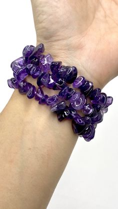 Amethyst Chips Bracelet You will receive 1 (ONE) Amethyst Chips Bracelet similar to the item in the picture Great for mixing and matching with other regular bracelets. . Amethyst has healing powers to help with physical ailments, emotional issues, and in Energy Healing and Chakra balancing. Amethyst crystal therapies are primarily associated with physical ailments of the nervous system, the curing of nightmares and insomnia, and balancing the crown chakra. FOLLOW US ON INSTAGRAM @earthsmineralsi Purple Crystal Bracelet For Gift, Amethyst Beaded Bracelet For Healing, Adjustable Purple Crystal Bracelet With Stones, Spiritual Purple Beaded Bracelets With Stones, Purple Spiritual Crystal Bracelet With Stones, Adjustable Purple Crystal Bracelet, Spiritual Purple Crystal Bracelet With Stones, Purple Amethyst Crystal Bracelet With Gemstone Beads, Purple Amethyst Stretch Bracelet With Natural Stones