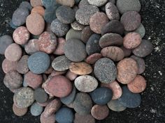 several different colored rocks on the ground