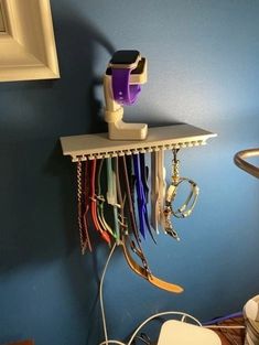 "My Apple Watch Band Organizer Shelf is a great place to put your charger, and to keep your watch bands. Do you have a ton of watch bands cluttering up your drawer? Can't find the right one when you want it? This is for you. I designed this shelf to fit 33 bands (double stacked) or 17 single stacked. There's a pass-through in the spine of the shelf to put a charge cord to place your apple watch or phone charger on top, or put a picture or anything really. Measures 8\" Wide, 4\" Deep, and 3.25\" Apple Watch Band Organizer Diy, Apple Watch Band Organizer, Apple Watch Band Storage, Apple Watch Holder, Watch Organizer, Best Apple Watch, Organizer Shelf, Apple Band, Watch Holder