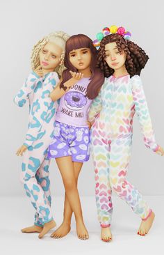 three girls in pajamas posing for the camera