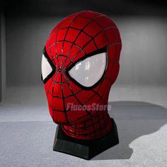 a close up of a spiderman mask on display