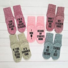 six pairs of socks with words on them