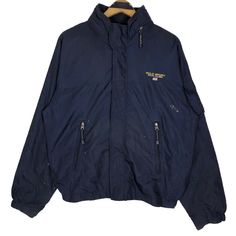 Vintage Polo Sport Ralph Lauren windbreaker jacket in navy blue colour. Full zip nylon jacket with foldable hoodie. Still in good condition EXCEPT some paint stains on the jacket. SEE THE PICTURES FOR MORE DETAILS. CONDITION : 7/10 MEASUREMENT Pit : 23.5 inch Length : 26 inch Shoulder : - Sleeve : 32 inch Size On Tag : L Recommended Size : L PAYMENT We accept PayPal only. The item will be ship 3-5 days once the payment has been made. NORMAL SHIPPING FEDEX USUALLY AROUND 7-21 DAYS BEFORE REACH TH Navy Nylon Long Sleeve Outerwear, Navy Long-sleeve Nylon Outerwear, Navy Long Sleeve Nylon Outerwear, Navy Windproof Nylon Outerwear, Navy Nylon Windproof Outerwear, Navy Nylon Outerwear For Outdoor, Navy Nylon Winter Windbreaker, Navy Nylon Windbreaker For Winter, Outdoor Long Sleeve Outerwear With Embroidered Logo