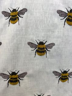 bees on white fabric with black and yellow accents