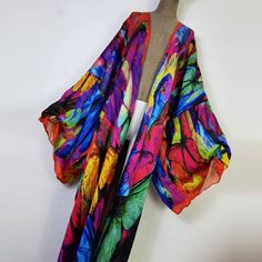 One Size fits S-3X/4X Kimono length: 58inch Material: Poly Silk (a lightweight, smooth, and shiny fabric that drapes and flows very well. An affordable alternative to silk) One Size Fits Most Size Chart Multicolor Flowy Wrap Kimono, Flowy Multicolor Wrap Kimono, Elegant Flowy Multicolor Kimono, Elegant Multicolor Flowy Kimono, Summer Multicolor Silk Kimono, Multicolor Shawl Kimono For Spring, Spring Party Multicolor Kimono, Spring Party Satin Kimono, Long Multicolor Party Kimono