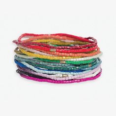 For the free-spirited fashionista who craves a kaleidoscope of color and texture, we present the Chelsea 18 Strand Luxe Beaded Stretch Bracelet Set. This showstopping stack is a true celebration of unrestrained bohemian style and artisanal craftsmanship. Featuring a mesmerizing array of 18 individual bracelets in eye-catching multicolored beads, the Chelsea set instantly energizes any look with its bold, eclectic blend of hues. But these aren't just basic beaded bangles - oh no. Every bracelet is meticulously hand-strung by skilled artisans, resulting in miniature works of wearable art designed to highlight your fierce, individualistic flair. The stretch fit allows each strand to hug your wrist with comfortable ease as you dance through life's vibrant adventures. Whether you're making a st Multicolor Multi-strand Friendship Bracelets For Beach, Festival Heishi Beaded Bracelets, Festival Heishi Beads Bracelets, Colorful Beaded Bohemian Stretch Bracelet, Bohemian Multicolor Stretch Bracelet For Beach, Colorful Bohemian Beaded Stretch Bracelet, Adjustable Bohemian Friendship Bracelets With Faceted Beads, Bohemian Adjustable Friendship Bracelets With Faceted Beads, Multicolor Multi-strand Bracelets