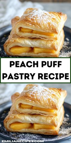 two stacks of puff pastry sitting on top of a black plate with powdered sugar