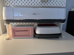 an appliance is sitting on top of a counter next to a toaster