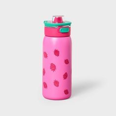 a pink water bottle with pineapples printed on the side and a green lid