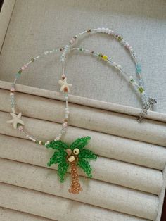 Necklace with a palm tree and starfish, inspired by Lilo from "Lilo & Stitch". Perfect for summer vacay :) Bead Pets, Lilo Stitch, Coconut Tree, Summer Breeze, Jewelry Inspo, Lilo And Stitch, Accessories Bracelets, Palm Tree, Ring Necklace