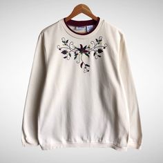 "CODE : 107 Vintage Blair Flower Cream Sweatshirt Size Large Flower Crewneck Flower Sweater Pullover Embroidered Logo Flower Shirt Jumper Size on Tag : L Details Measurement  Arm Pit to Arm Pit : 23\"inches Back Collar to Hem : 28\"inches Condition :  Great Vintage Condition..❌NO HOLES AND NO STAIN❌Please refer pictures detail.‼️ 📮 SHIPING > WE ARE USING DHL EXPRESS SHIPING ITS TAKE 3-5 ARRIVE.PLEASE DROP YOUR PHONE NUMBER AFTER PURCHASE.📮" Fall Floral Applique Crew Neck Sweater, White Sweater With Floral Embroidery And Crew Neck, Cream Crew Neck Sweater With Floral Embroidery, White Crew Neck Sweater With Floral Embroidery, Cream Floral Embroidered Crew Neck Sweater, White Floral Embroidered Sweatshirt For Fall, Cream Crew Neck Top With Floral Embroidery, Cream Floral Print Crew Neck Top, Cream Crewneck